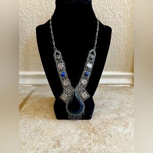 Short  handmade necklace with beautiful blue stone.